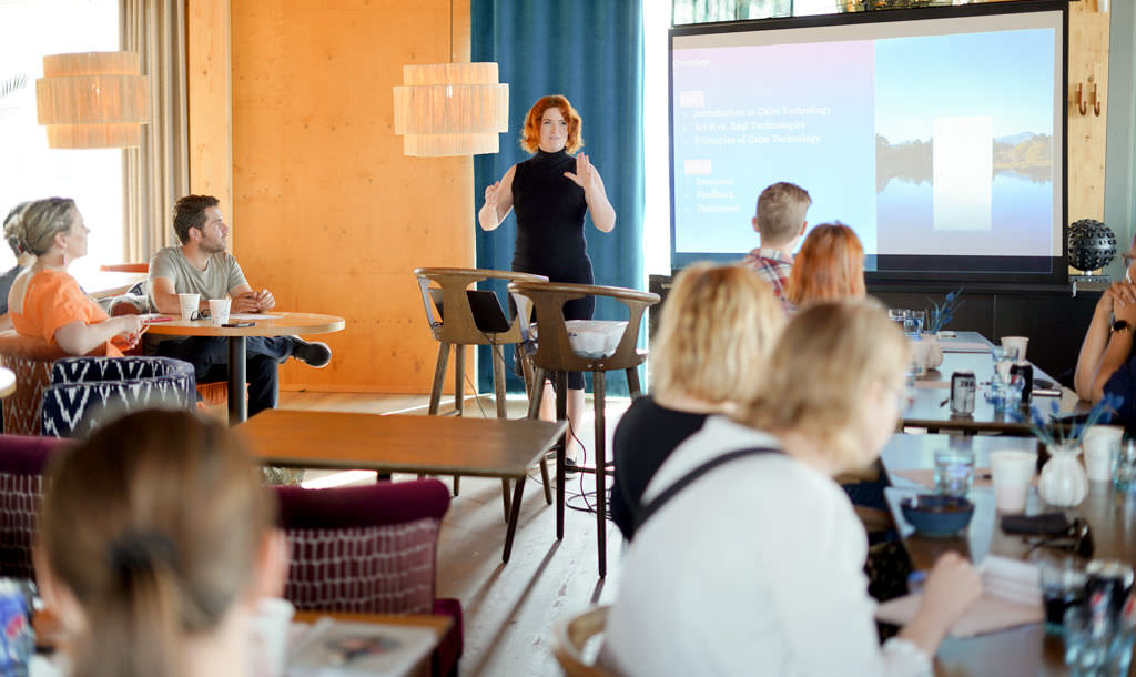 Amber giving a workshop and you can see the delegates sitting in front of her with their back facing the camera.