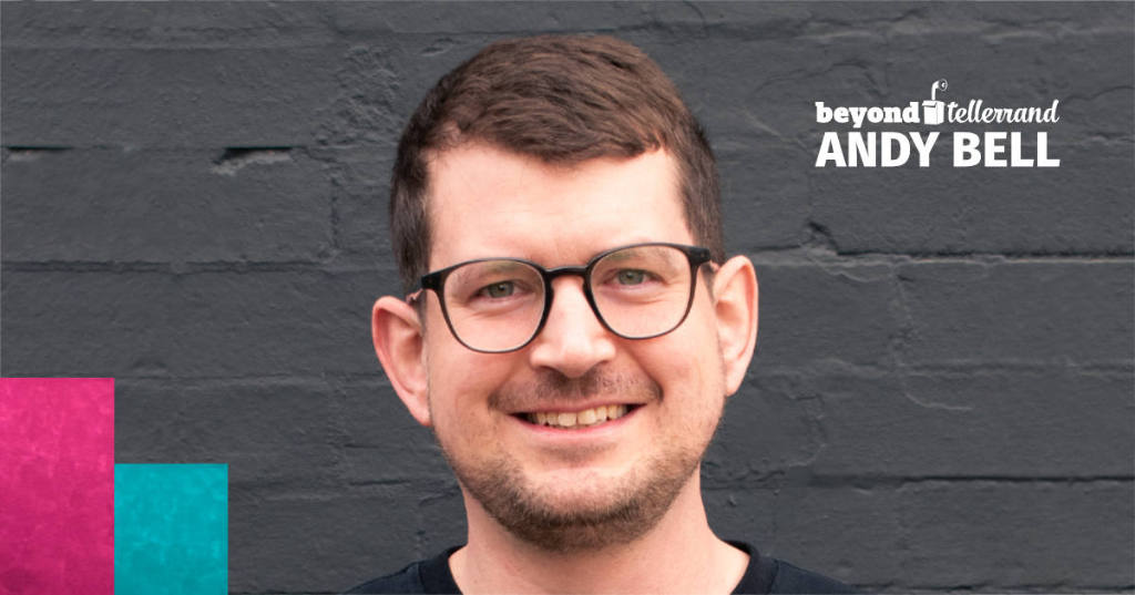 A headshot of Andy Bell in front of a grey wall.