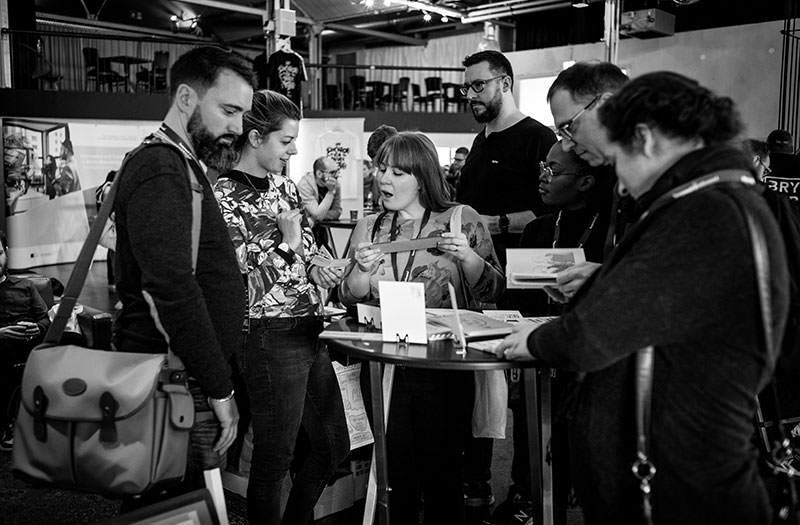 Photo shows attendees during the break in the exhibition