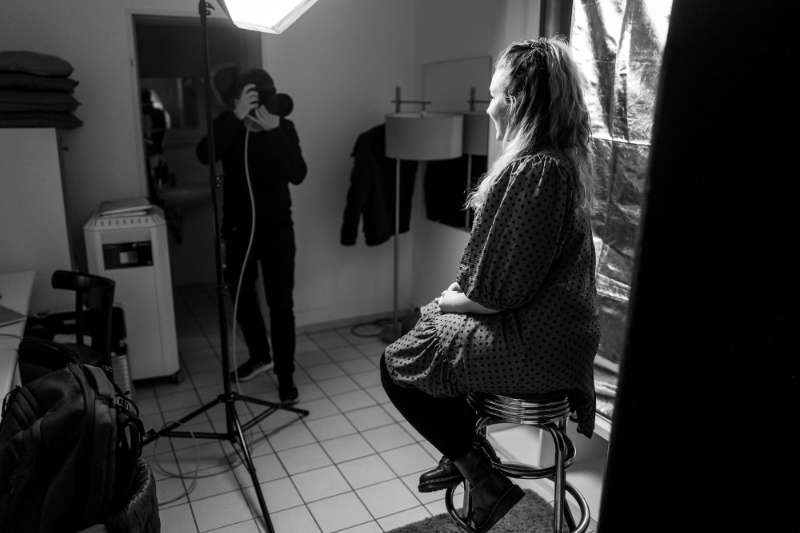 You can see Norman in the background taking a photo of Molly Watt in his little pop-up studio