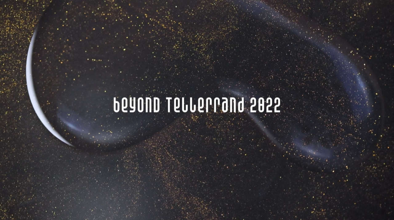 Screenshot of this year’s opening titles showing a mix of liquids that look like space with stars – letters state beyond tellerrand 2022