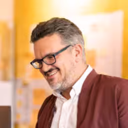 The logo of the side event Lunch Break Session: The Robot Uprising is Already Here. Let's Rise Together.