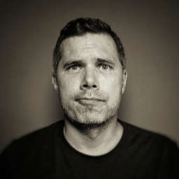 On this photo you see a headshot of Phil Hawksworth. He is looking into the camera with a bit of a goofy face.