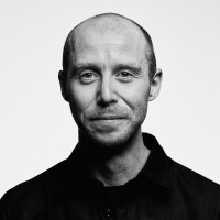 A photo with a portrait of Mike Hill