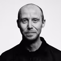 A photo with a portrait of Mike Hill