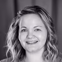 A portrait shot of Stephanie Eckles. She is smiling into the camera with a straight look into the camera.